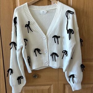 White Cardigan with Black Bow Accents